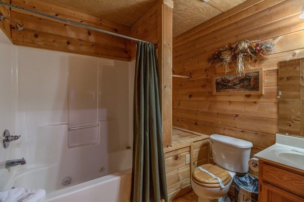 Bathroom with a tub and shower at Sunny Side Up, a 2 bedroom cabin rental located in Gatlinburg