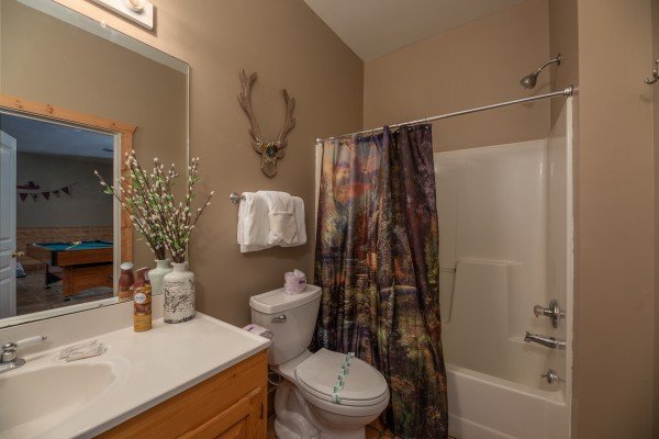 Bathroom with a tub and shower at Hawk’s Heart Lodge, a 3 bedroom cabin rental located in Pigeon Forge