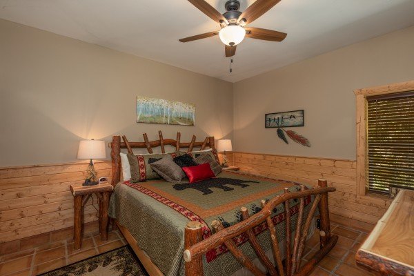 Bedroom with a log bed at Hawk’s Heart Lodge, a 3 bedroom cabin rental located in Pigeon Forge