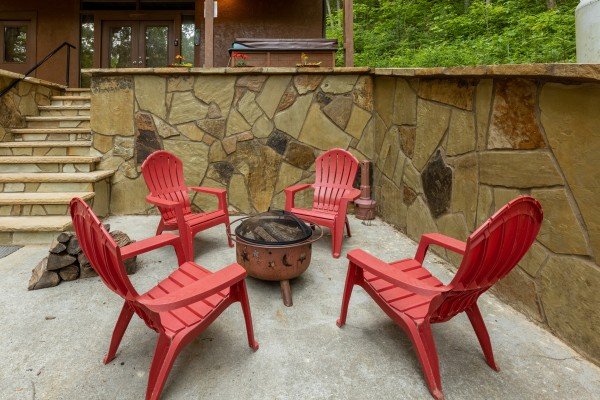 Fire pit at Hawk’s Heart Lodge, a 3 bedroom cabin rental located in Pigeon Forge