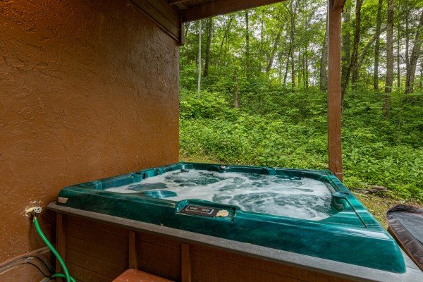 Hot tub at Hawk’s Heart Lodge, a 3 bedroom cabin rental located in Pigeon Forge