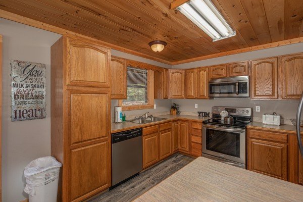 Kitchen with stainless appliances at Bearadise 4 Us, a 3 bedroom cabin rental located in Pigeon Forge