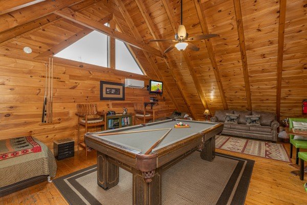 Pool table in the loft at Absolutely Wonderful, a 2 bedroom cabin rental located in Pigeon Forge