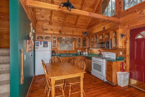 Kitchen with dining table for five at Shiloh, a 3 bedroom cabin rental located in Gatlinburg