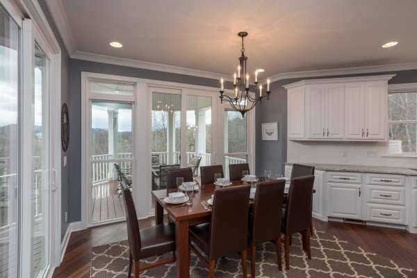 Dining table for eight in the kitchen at Summit Glory, a 5 bedroom cabin rental located in Pigeon Forge