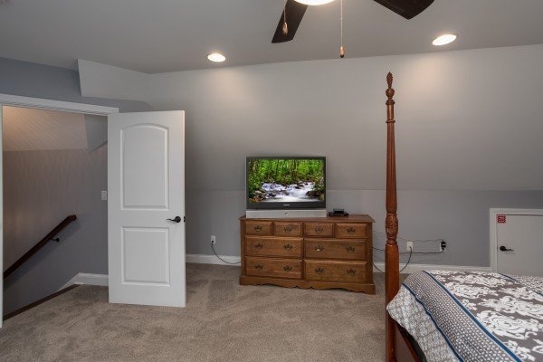 Dresser and TV in a bedroom at Summit Glory, a 5 bedroom cabin rental located in Pigeon Forge