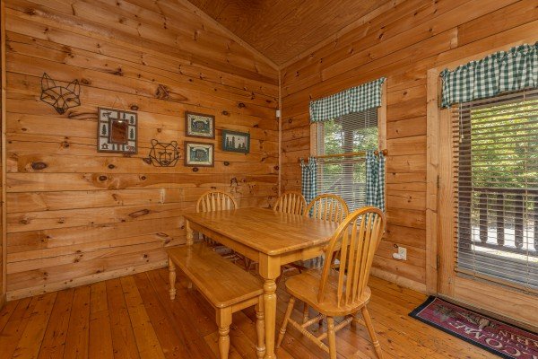 Dining space for six at Moonlight in the Boondocks, a 2 bedroom cabin rental located in Gatlinburg