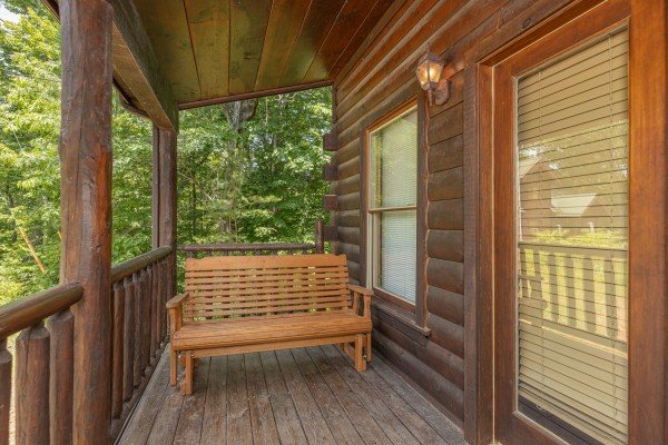 Porch swing at Moonlight in the Boondocks, a 2 bedroom cabin rental located in Gatlinburg