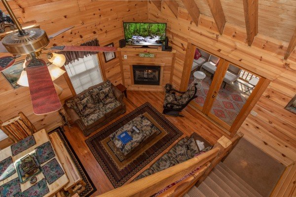 Looking down into the living room at My Smoky Mountain Hideaway, a 3 bedroom cabin rental located in Pigeon Forge