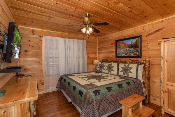 King bedroom with dresser and TV at My Smoky Mountain Hideaway, a 3 bedroom cabin rental located in Pigeon Forge