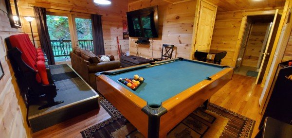 Pool table and theater room at My Smoky Mountain Hideaway, a 3 bedroom cabin rental located in Pigeon Forge