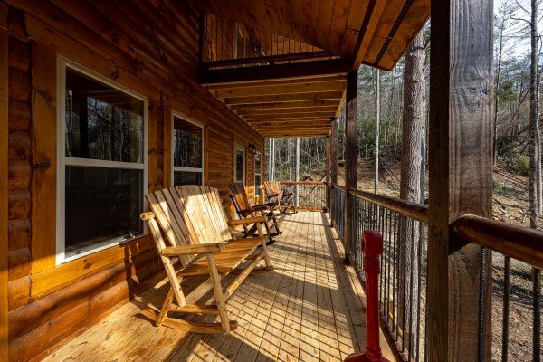 Deck rocking chairs and bench at Swimmin' Hole In 1, a 2 bedroom cabin rental located in Gatlinburg