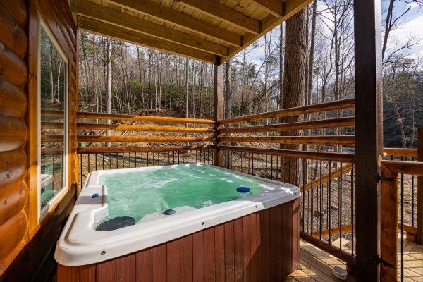Hot tub at Swimmin' Hole In 1, a 2 bedroom cabin rental located in Gatlinburg
