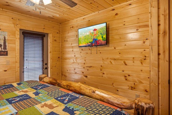 King bedroom TV at Swimmin' Hole In 1, a 2 bedroom cabin rental located in Gatlinburg