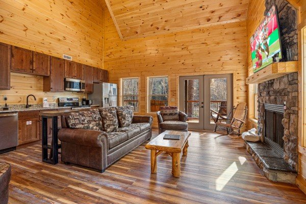 Living room and kitchen at Swimmin' Hole In 1, a 2 bedroom cabin rental located in Gatlinburg