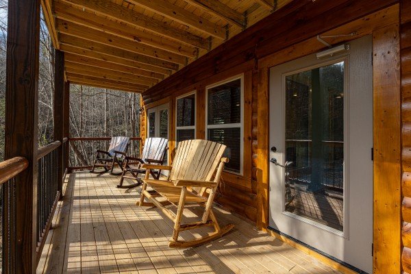 Rocking chairs and bench at Swimmin' Hole In 1, a 2 bedroom cabin rental located in Gatlinburg