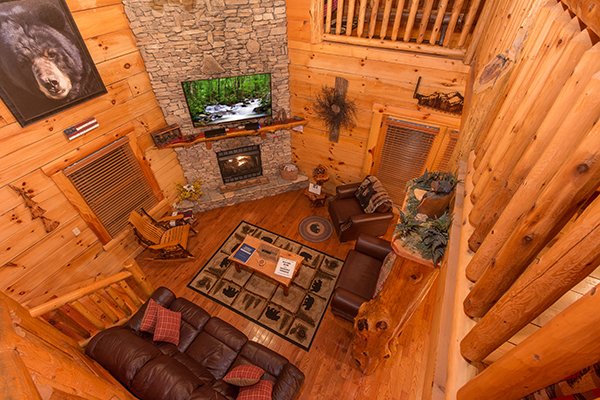 Looking down into the living room from the second floor at Bearfoot Paradise, a 3-bedroom cabin rental located in Pigeon Forge