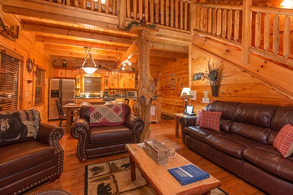Leather sofa and two chairs in the open concept living room at Bearfoot Paradise, a 3-bedroom cabin rental located in Pigeon Forge