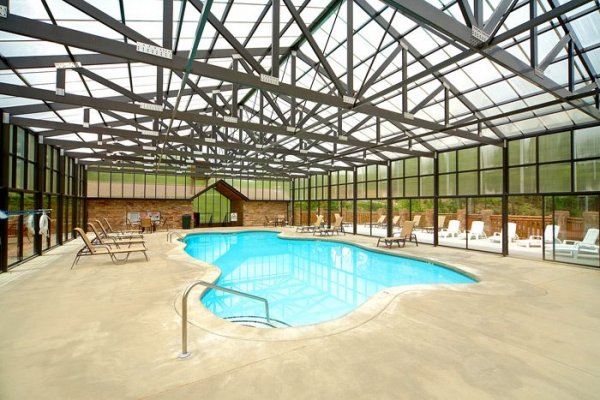 Family Ties Lodge, a 4-bedroom cabin rental located in Pigeon Forge has access to the pool at Hidden Springs Resort