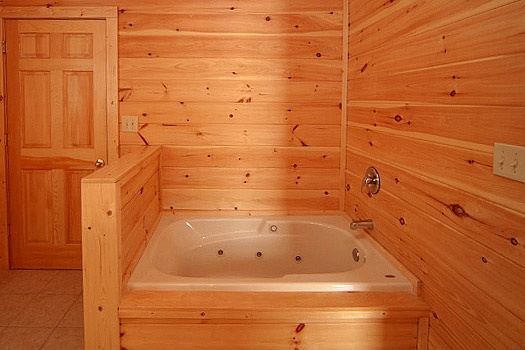 One of four jacuzzi tubs in bathrooms at Highlander, a 4 bedroom cabin rental located in Gatlinburg