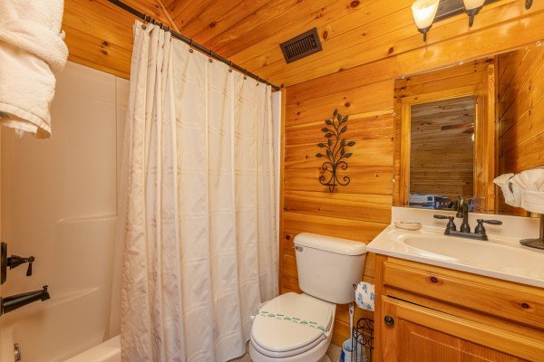 Bathroom with a tub and shower at Rainbow's End, a 4 bedroom cabin rental located in Pigeon Forge