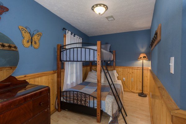 Bunk bed in a bedroom at Breezy Mountain Lodge, an 11-bedroom cabin rental located in Pigeon Forge