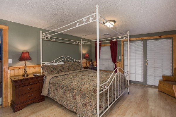 Canopy bed at Breezy Mountain Lodge, an 11-bedroom cabin rental located in Pigeon Forge