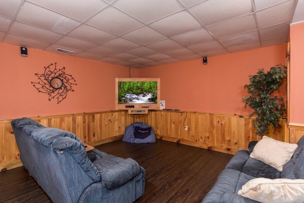 Media room with sleeper sofas at Breezy Mountain Lodge, an 11-bedroom cabin rental located in Pigeon Forge