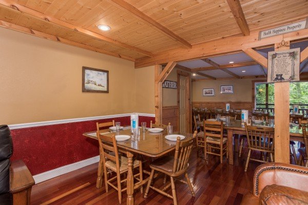 Lots of dining space for a group at Breezy Mountain Lodge, an 11-bedroom cabin rental located in Pigeon Forge