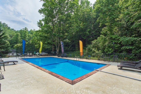 Outdoor pool at Shagbark Resort; at Breezy Mountain Lodge, an 11-bedroom cabin rental located in Pigeon Forge