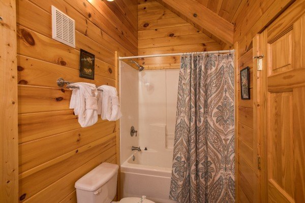 Bathroom with a tub and shower at Leconte View Lodge, a 3 bedroom cabin rental located in Pigeon Forge