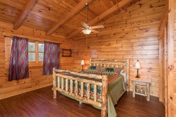 King log bed in the loft space at Leconte View Lodge, a 3 bedroom cabin rental located in Pigeon Forge