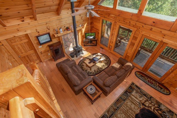 Looking down into the living room from the upper floor at Leconte View Lodge, a 3 bedroom cabin rental located in Pigeon Forge