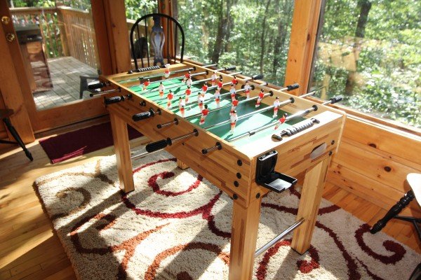 Foosball table at Black Bear Magic, a 4-bedroom cabin rental located in Gatlinburg