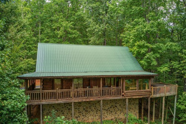 Exterior view of the cabin in the woods at Black Bear Magic, a 4-bedroom cabin rental located in Gatlinburg