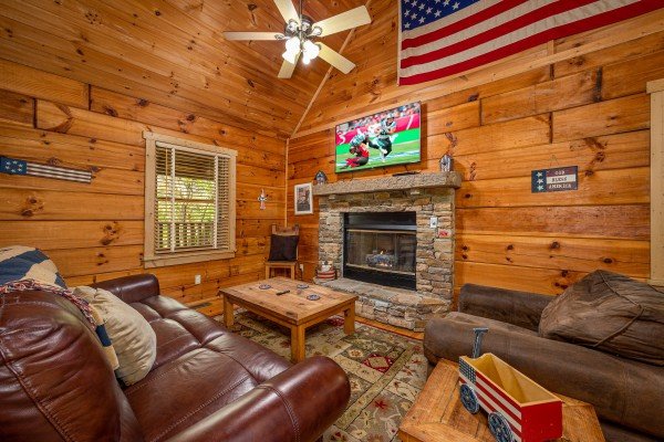 Living room fireplace at Old Glory, a 2 bedroom cabin rental located in Pigeon Forge