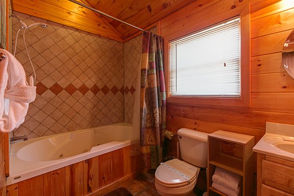 Jacuzzi and shower combo at Pot O' Gold, a 4 bedroom cabin rental located in Pigeon Forge