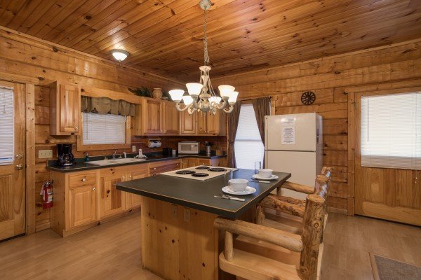 Kitchen with breakfast bar at Mountain Magic, a 1 bedroom cabin rental located in Pigeon Forge