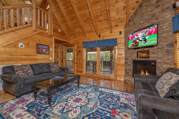 Fireplace and flat screen at Rocky Top Memories, a 2 bedroom cabin rental located in Pigeon Forge