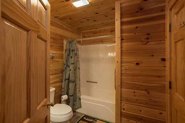Bathroom with a tub and shower at Lake Life, a 4 bedroom cabin rental located in Sevierville