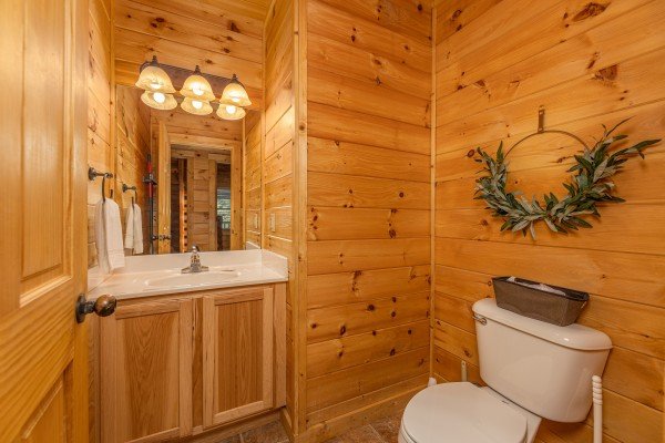 Half bath at Happy Hideaway, a 4 bedroom cabin rental located in Pigeon Forge