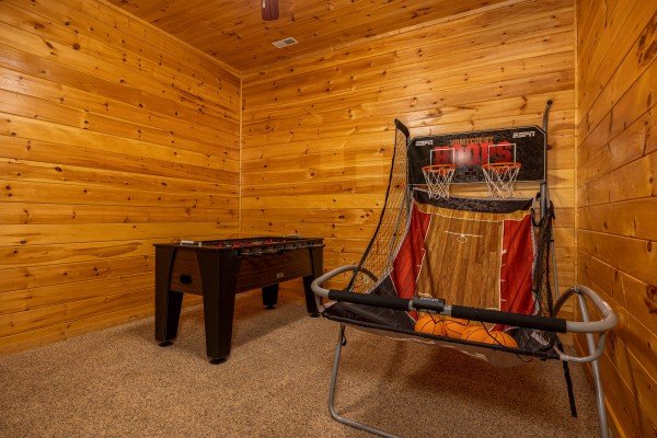 Basketball and foosball at Happy Hideaway, a 4 bedroom cabin rental located in Pigeon Forge