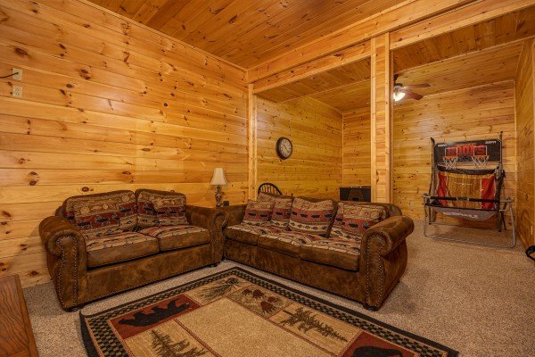Couch and loveseat at Happy Hideaway, a 4 bedroom cabin rental located in Pigeon Forge