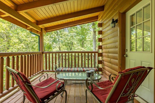 Deck seating at Happy Hideaway, a 4 bedroom cabin rental located in Pigeon Forge 