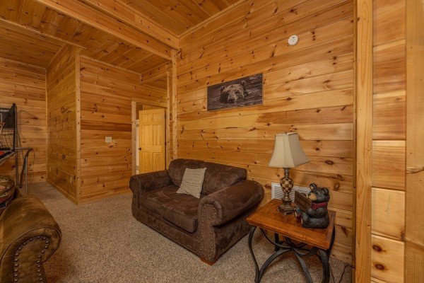 Downstairs seating at Happy Hideaway, a 4 bedroom cabin rental located in Pigeon Forge