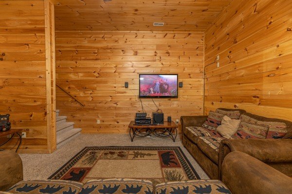 Downstairs seating and television at Happy Hideaway, a 4 bedroom cabin rental located in Pigeon Forge