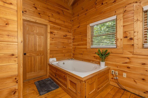 Jacuzzi tub on main floor at Happy Hideaway, a 4 bedroom cabin rental located in Pigeon Forge
