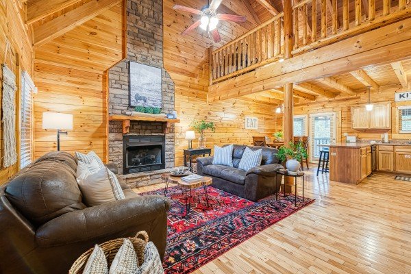 View of living room and kitchen's open floorplan at Happy Hideaway, a 4 bedroom cabin rental located in Pigeon Forge