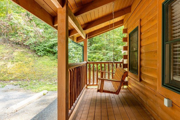 Porch Swing at Happy Hideaway, a 4 bedroom cabin rental located in Pigeon Forge