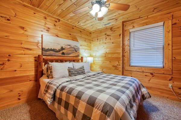Downstairs queen room at Happy Hideaway, a 4 bedroom cabin rental located in Pigeon Forge 